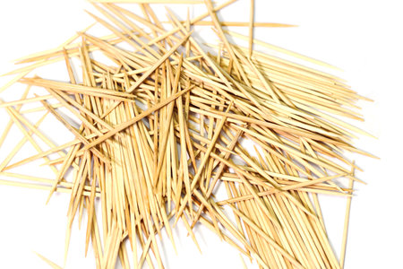 Closeup of group brown wooden toothpick on white backgroundの写真素材