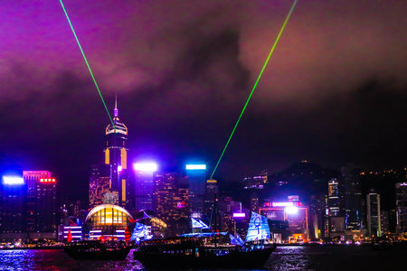 Landscape of Symphony of Lights and two boat of life at Victoria Harbor,Hongkongのeditorial素材