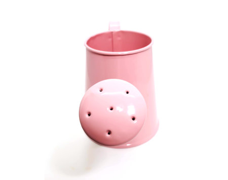 Closeup of front Mini pink watering can for decorate on white backgroundの写真素材