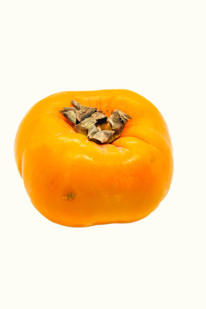 Closeup of Fresh ripe orange persimmon isolated on white backgroundの写真素材