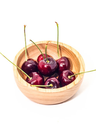 Group Fresh cherry on brown wooden cupの写真素材