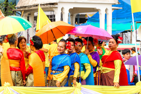 SAMUTSAKORN, THAILAND - JULY 27, Thai woman wear Thai dress in Big Boat of candles Parade at Katumban in Samutsakorn, Thailand on July 27, 2018.JPGのeditorial素材