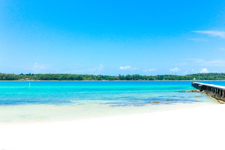 Beauty blue sea and white sand with blue sky in thailandの写真素材