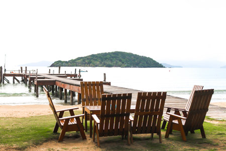 Wooden Pier and wooden chair at Koh Mak Island in Trat, Thailandの写真素材