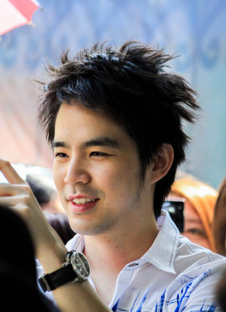 BANGKOK, THAILAND - January16, 2011. Kawee Tanjararak is singer Superstar in Thailand relax in Birthday Party with FC on January16, 2011のeditorial素材