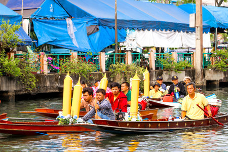 SAMUTSAKORN, THAILAND - JULY 27, Closeup Thailand People in Parading Traditional of candles to temple at Katumban in Samutsakorn, Thailand on July 27, 2018のeditorial素材