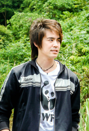 CHAINGMAI, THAILAND - JUNE 28, 2008. brand ambassador WWF Kawee Tanjararak singer Superstar  is shooting nature on JUNE 28, 2008のeditorial素材