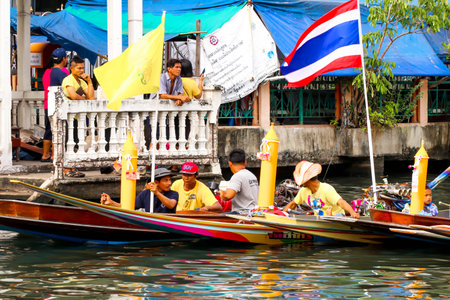 SAMUTSAKORN, THAILAND - JULY 27, Team People in boat Parade Traditional of candles to temple at Katumban in Samutsakorn, Thailand on July 27, 2018のeditorial素材