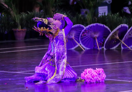 Single child girl Thai dance and press the hands together at the chest or forehead in sign of respect.のeditorial素材