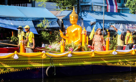 SAMUTSAKORN, THAILAND - JULY Parade candle and Buddha statue to temple at Katumban in Samutsakorn, Thailand on July 16, 2019.JPGのeditorial素材