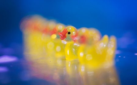 Yellow rubber ducks with bubbles and bokeh. Bathtime!の写真素材