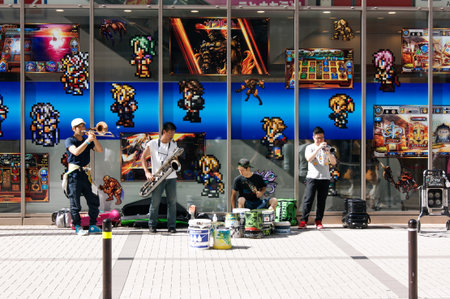Street musicians playing in front of a videogame shop at Akihabara districtのeditorial素材