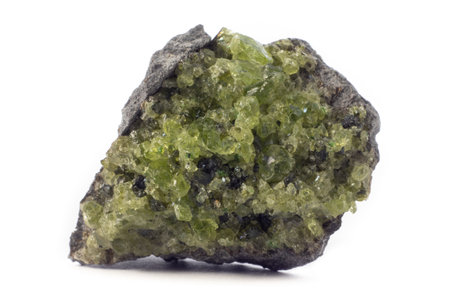 Rock with peridot olivine mineral from the USA isolated on a pure white backgroundの写真素材