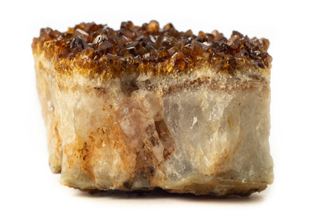 Block of natural citrine quartz mineral from Brazil isolated on a pure white backgroundの写真素材
