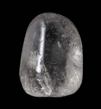 Polished clear quartz mineral from Brazil isolated on a pure black backgroundの写真素材