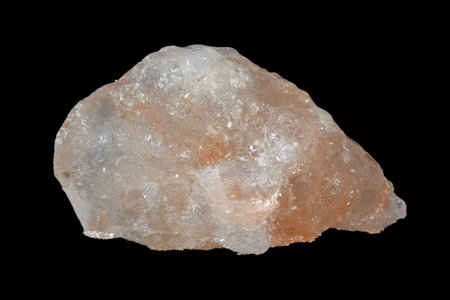 Raw halite mineral from Spain, commonly known as rock salt isolated on a pure black backgroundの写真素材