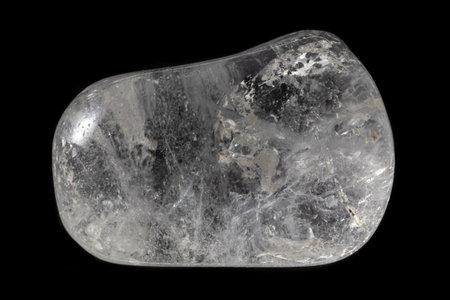 Polished clear quartz mineral from Brazil isolated on a pure black backgroundの写真素材