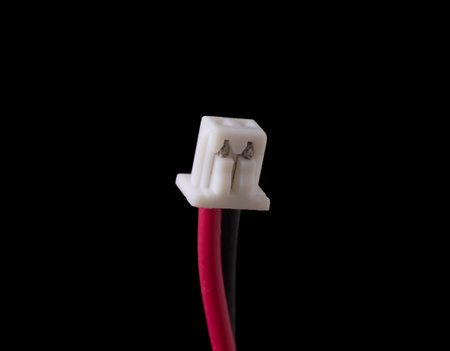 Micro jst 1.25 2 pin male plug isolated on black. Standard connector for small RC vehicles, batteries and motorsの写真素材
