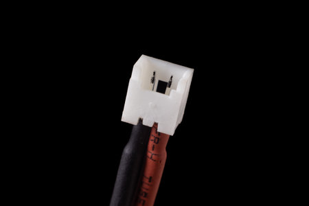 Micro jst 1.25 2 pin female plug isolated on black. Standard connector for small RC vehicles, batteries and motorsの写真素材