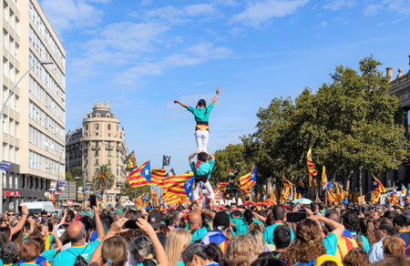 Barcelona, Catalonia / Spain - September 11, 2019: Young people during a Castellers performance, a...
