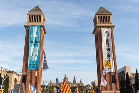 Barcelona, Catalonia / Spain - September 11, 2019: Gigant banners hanging from the towers in Fira de Montjiuc. Independentist rally at La Diada, Catalonia's National Day.のeditorial素材