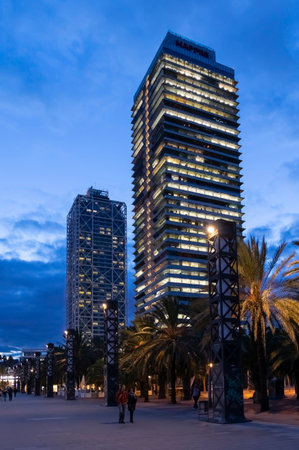 Barcelona , Spain - Nov 15, 2019: Mapfre tower and Arts hotel skyscrapers illuminated at nightのeditorial素材