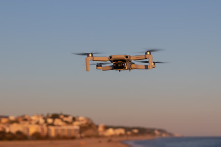 Catalonia, Spain - Jan 11, 2020: DJI mavic mini flying near the coast at sunset.のeditorial素材
