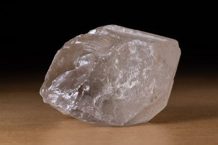 Translucent smoky quartz mineral from Brazil over a wooden tableの素材 [FY310146988196]