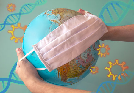 Hands holding the world with a face mask and different virus and dna symbols around. Represent the earth in a virus environment.の写真素材