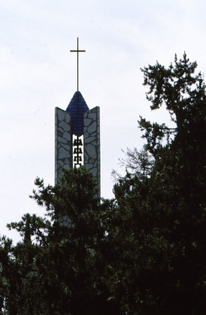 Bell tower of church with crossの写真素材