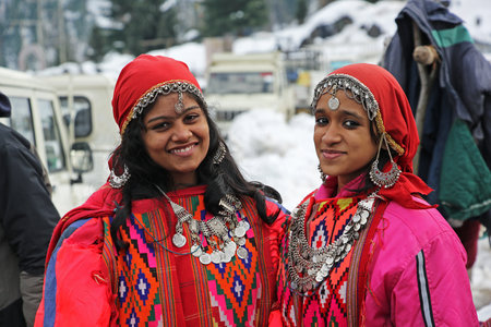 Manali, India - December 26, 2013: Beautiful teen girls dressed in the traditional tribal attire,...