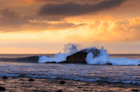 Sunrise on the Pacific with a Mountain in Viewの写真素材