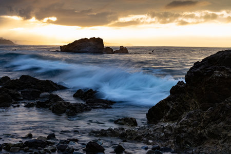 Pacific Ocean Washing over the Rocks at the Coastの写真素材
