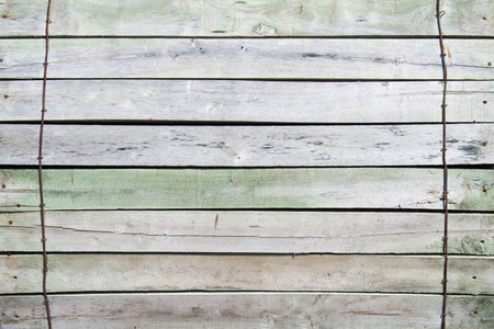 Closeup of wooden paneling locked by iron strandsの写真素材