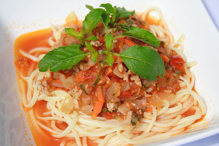 Fried spaghetti with tomato sauce and chopped meatの写真素材