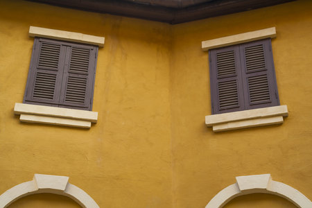 Vintage windows and yellow wall