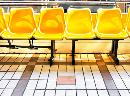 Yellow chairs in walkway sideの写真素材