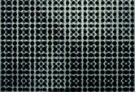 Silver metal background with hole grill slots and light reflectionの写真素材