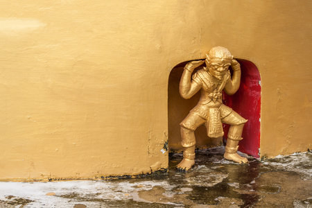 Decorative giant statue on pagoda wallの写真素材