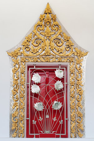 The decorative art of the faith of Thai temple windowの写真素材