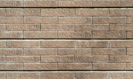 Stone granite wall of building for background and texture