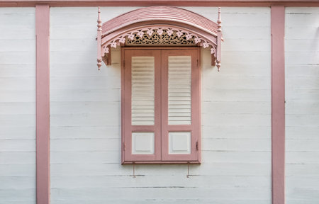 The wooden window of an antique building in Thailandの写真素材