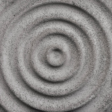 Circle wave relief on granite stoneの写真素材