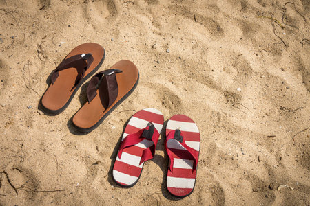 Rubber slippers on the beachの写真素材