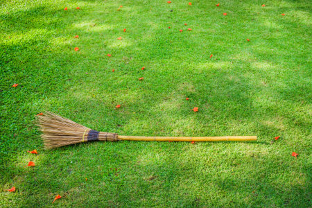 A broom laid down on a lawnの写真素材