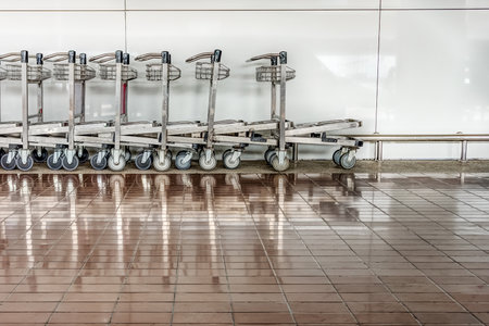 Baggage carts are provided in airports for transporting luggageの写真素材