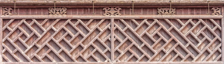 The antique Chinese wooden carved wall and perforated patternの写真素材