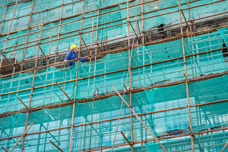 Laborers at construction site of buildingのeditorial素材