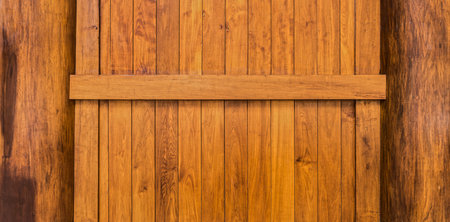 Wooden wall with beam and columns constructed from teak wood for background and textureの写真素材