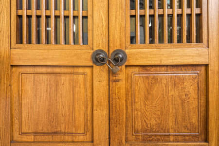 Closeup shot of new wooden door with padlockの写真素材